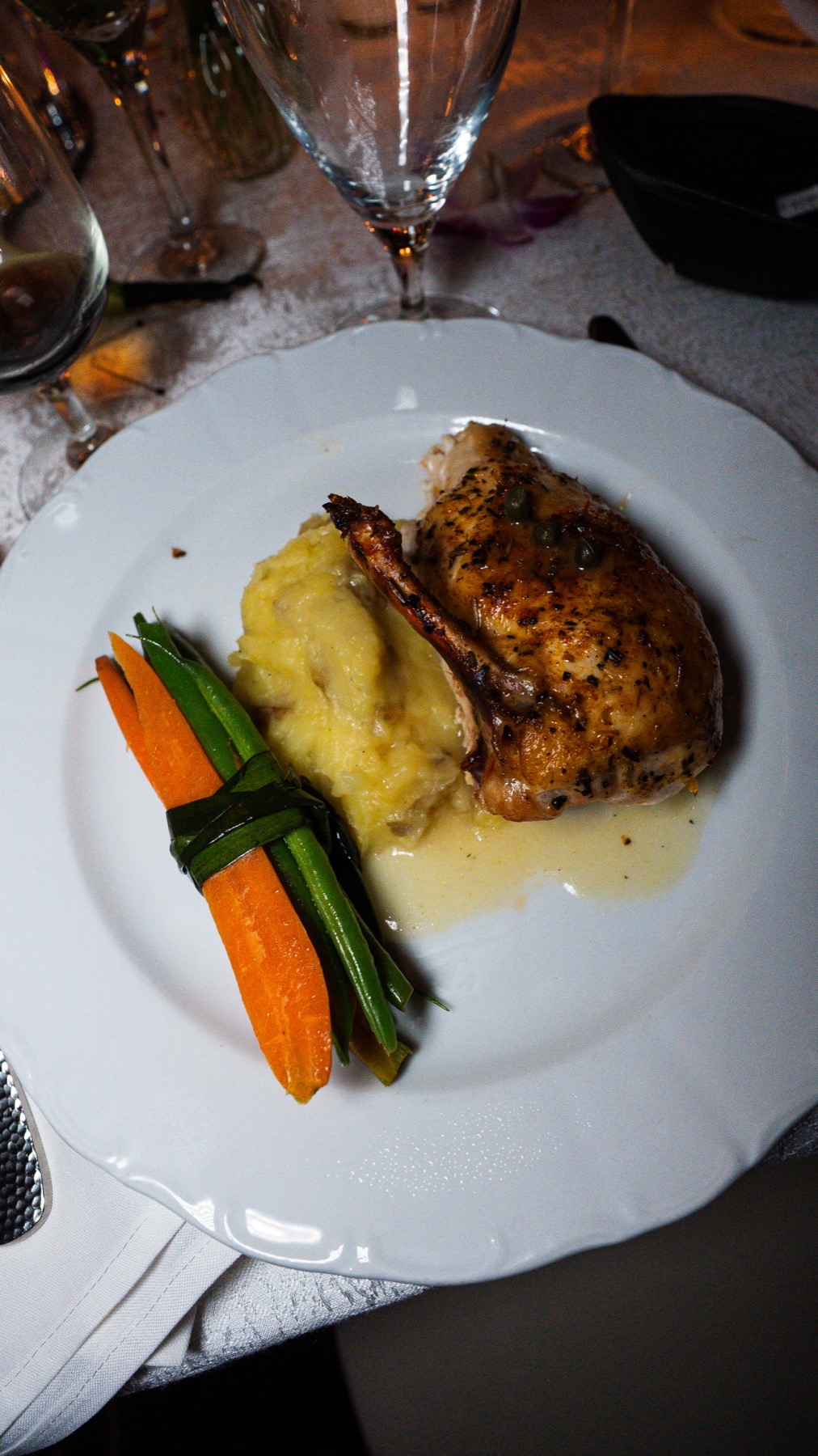 Plated kosher chicken dinner with vegetables
