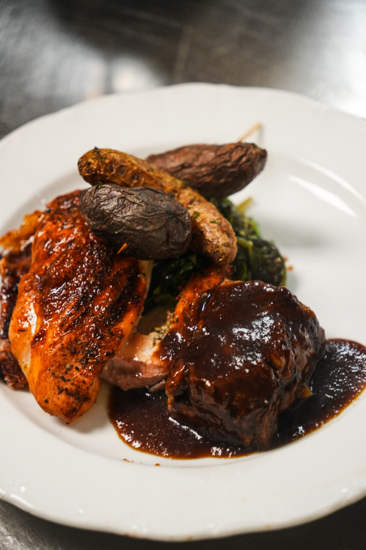 Plated kosher roast chicken and short rib entree