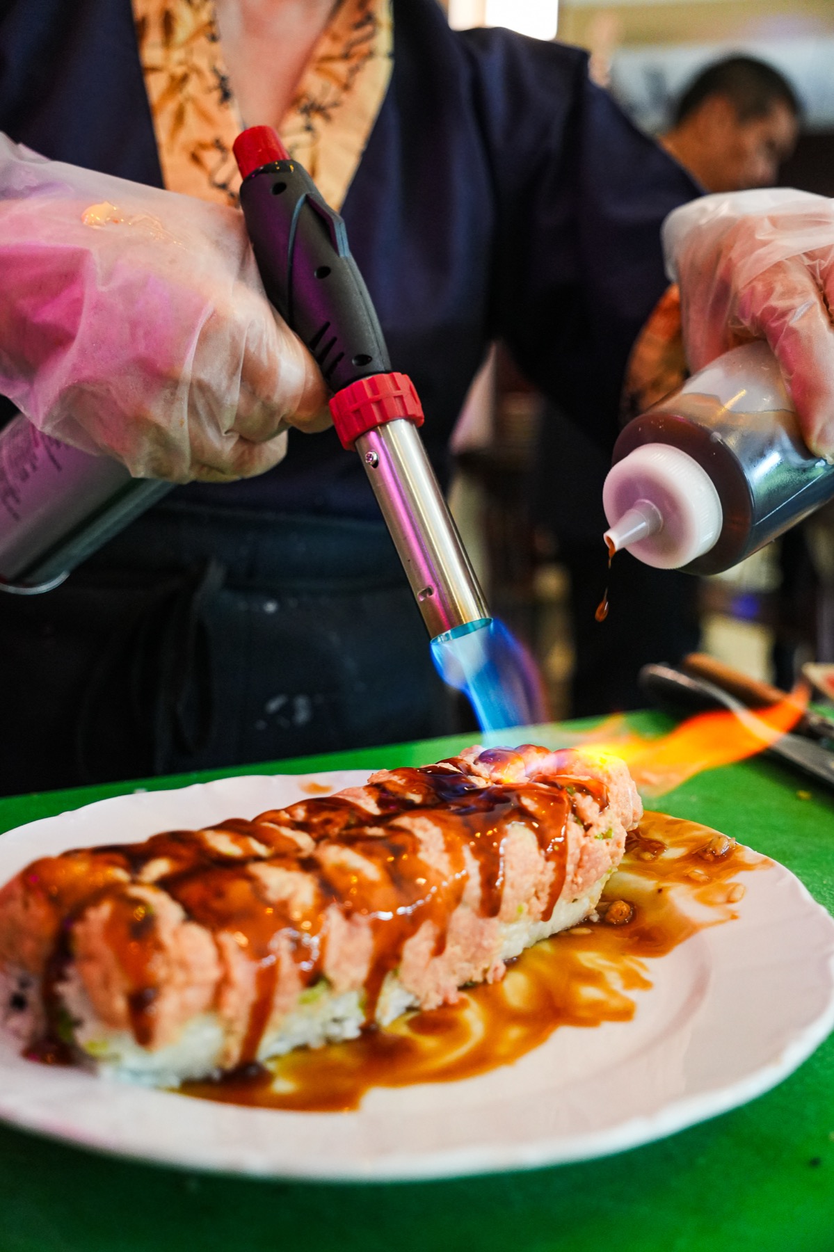 Flaming kosher chef station at a catered event