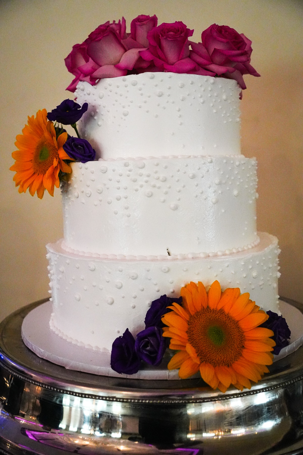 Wedding cake with florals for a kosher wedding celebration