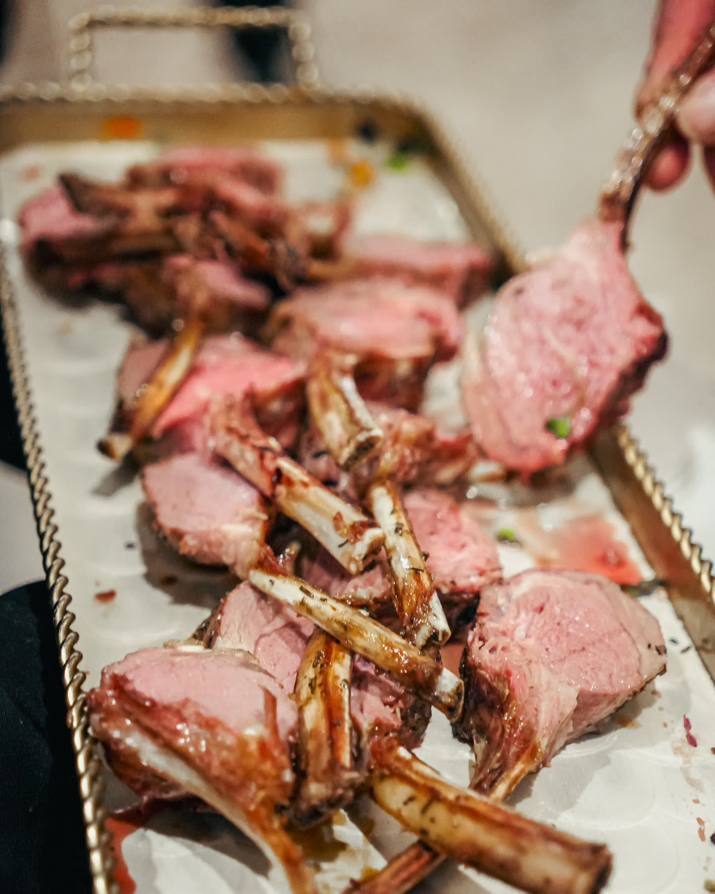 Kosher lamb chops plated for dinner service