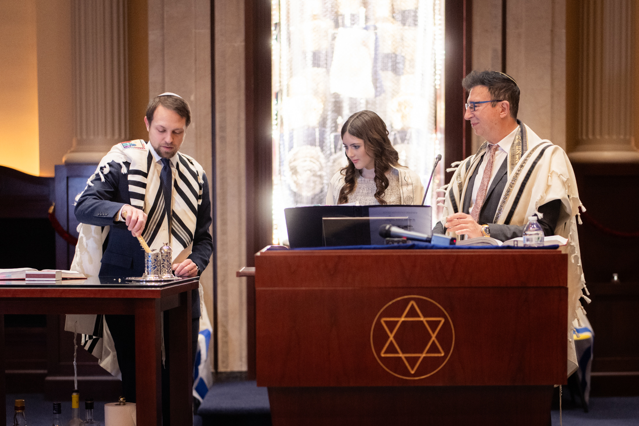 Family participating in a Havdalah ceremony during the bat mitzvah service