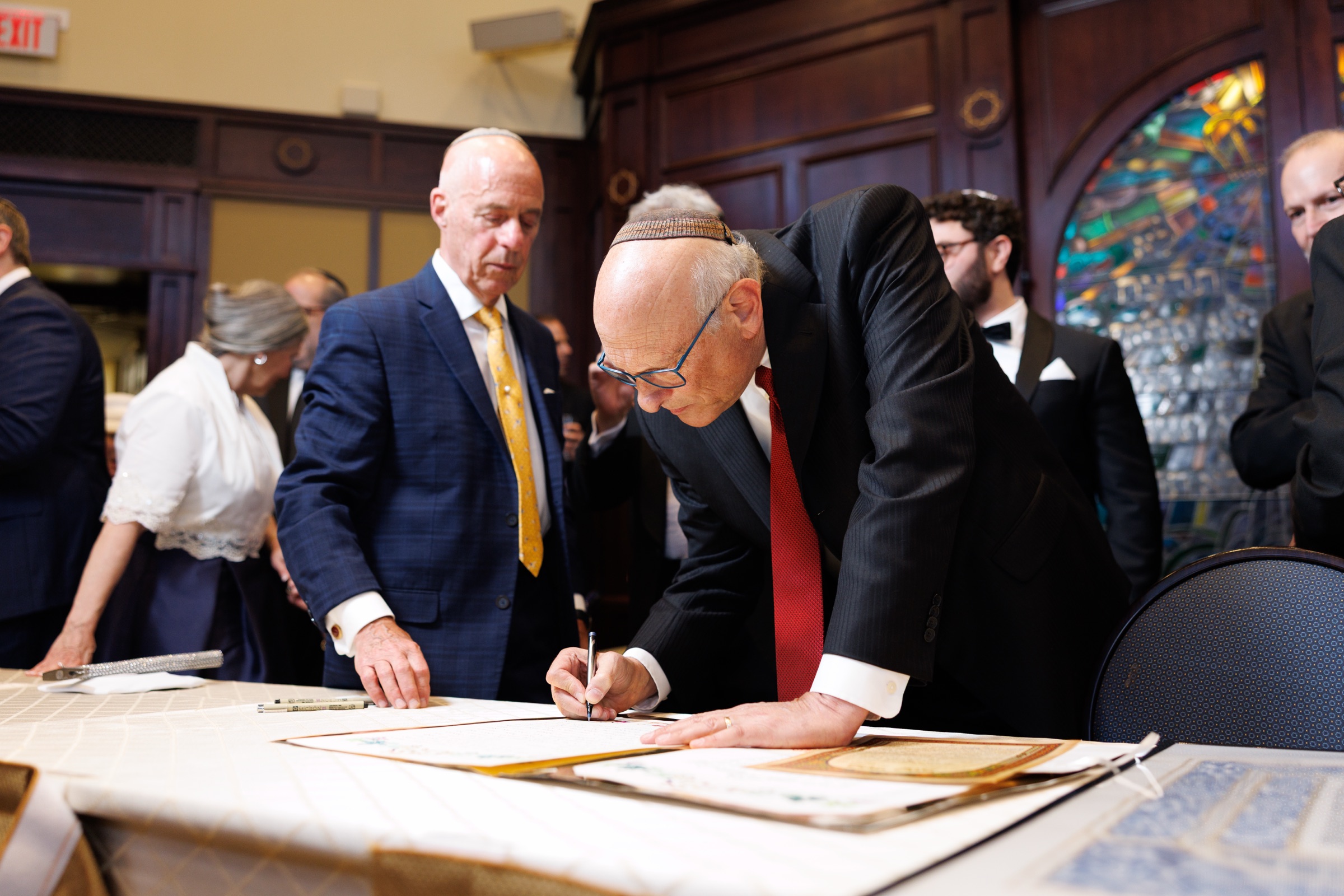 Ketubah signing with family gathered in the Tisch room